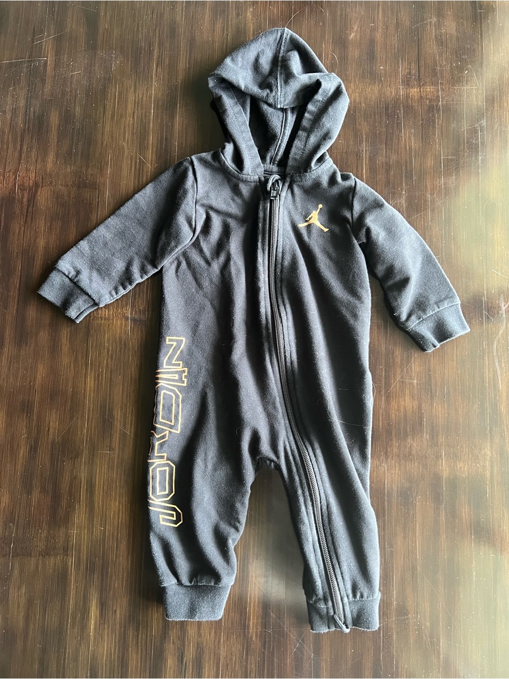Jordan Black Hooded Baby One-Piece with Gold Accents